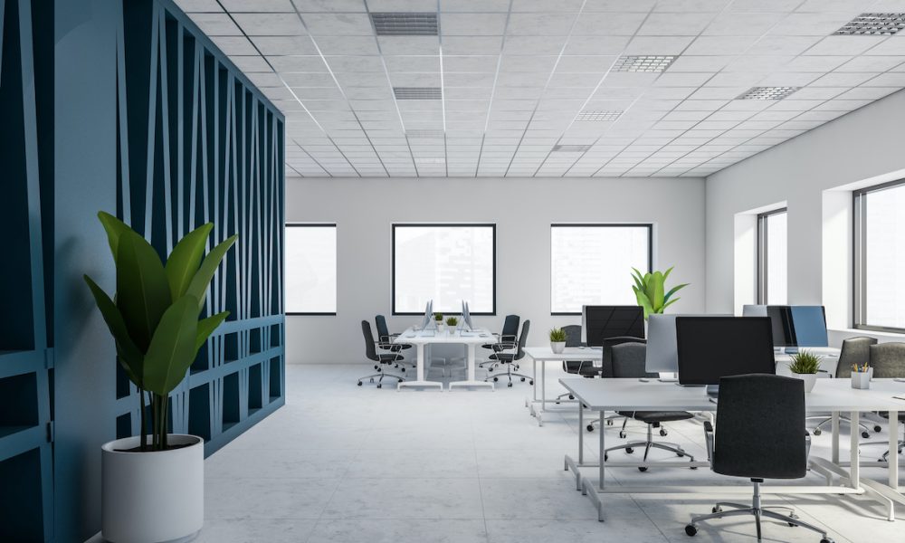 Interior of stylish open space office with white and blue walls, white tiled floor and rows of computer tables. 3d rendering